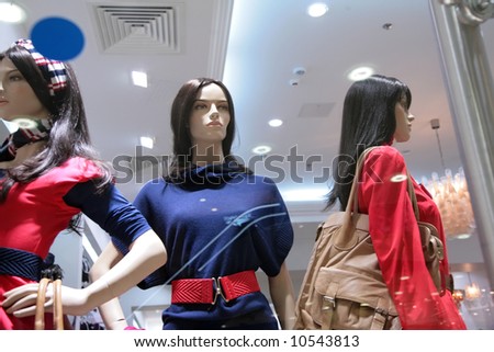 three mannequins in store