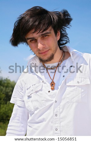young latino man with beard outdoor