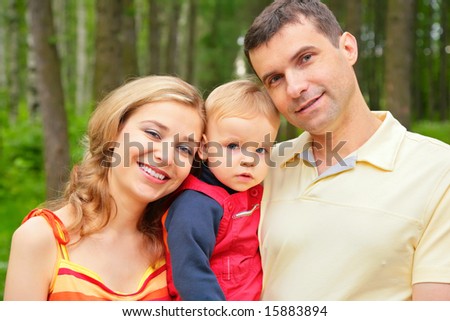parents and son in park