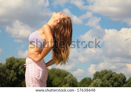 Young woman bend back