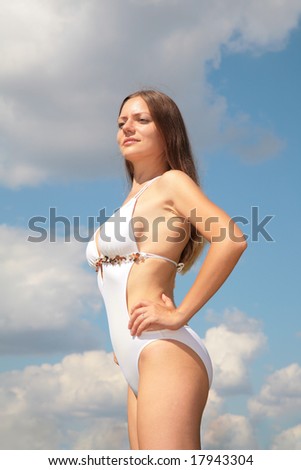 Girl in bathing suit against sky