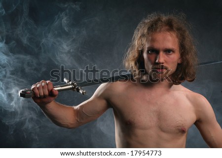 Man with sword in smoke