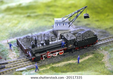 Model of steam locomotive is loaded by coal