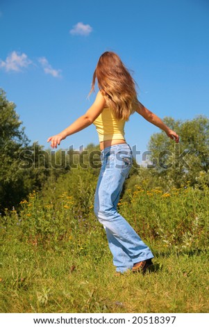 Young girl dancing in park