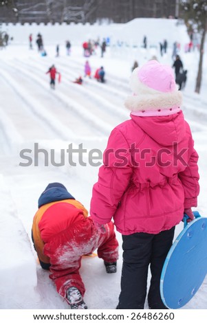 Children on ice slope in park