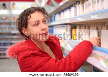 young woman in shop of household cosmetics
