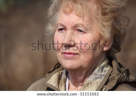 Aged woman face, spring outdoor