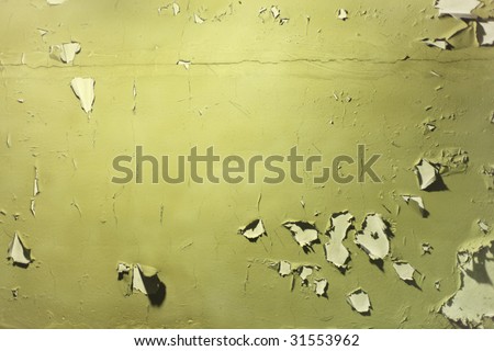 Wall with peeled off green paint