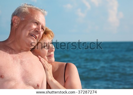 portrait of aged  pair against sea