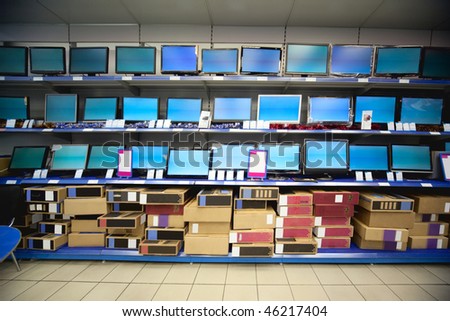 Rack with liquid crystal displays and monitors in electronics shop