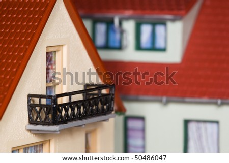toy plastic house with an extension and balcony