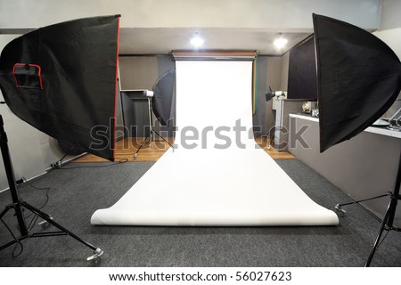 interior of professional photo studio with white background