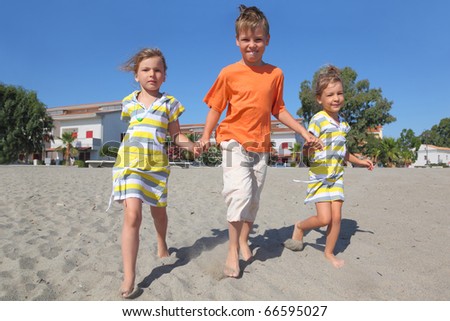 Girl   Holding Hands on Little Boy And Two Girls Walking On Beach  Holding For Hands  Trees