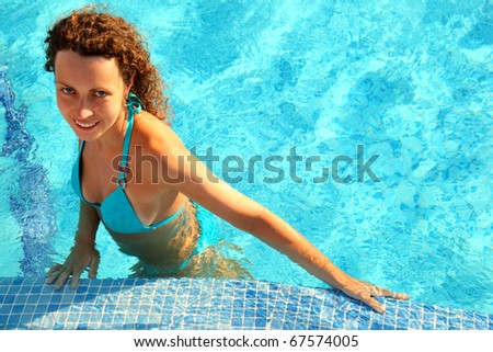 girls with light brown hair and blue. stock photo : Smiling girl in