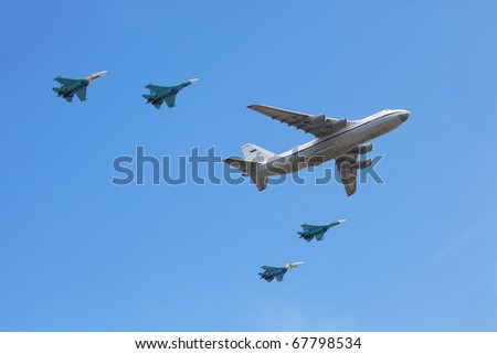 MOSCOW - MAY 9: An-124 plane accompanied by group of Su-27 fighters on parade in honor of Great Patriotic War victory on May 9, 2010 in Moscow, Russia