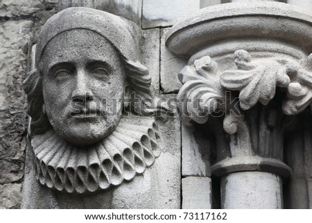 old bas-relief made of stone in Christian Church, melancholy face
