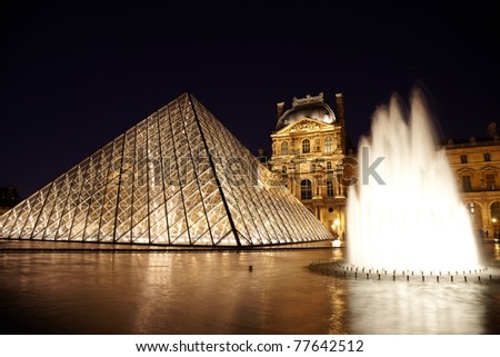PARIS - JANUARY 1: Louvre Pyramid, fountain and Pavillon Rishelieu in evening, January 1, 2010, Paris, France. This pyramid form structure was designed by the Chinese-born American architect I. M. Pei
