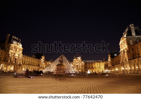 PARIS - JANUARY 1: Louvre museum, equestrian statue of Louis XIV, night, January 1, 2010, Paris, France. Louis XIV equestrian statue designates point of beginning of so-called historical axis of Paris