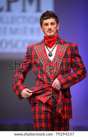 MOSCOW - FEBRUARY 22: A model wears a checkered suit from Slava Zaytzev and walks catwalk in the Collection Premiere Moscow, leading fashion fair in Eastern European market, on February 22, 2011 in Moscow, Russia