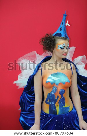 MOSCOW - OCTOBER 2: Beautiful model with bodyart and hat as Eiffel Tower at XVII International Festival \