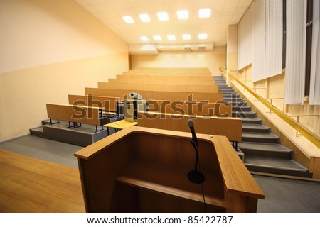 Large classroom, university lecture hall; view from lectern with microphone