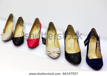 Row of six various women shoes in shop; new collection; attractive discounts