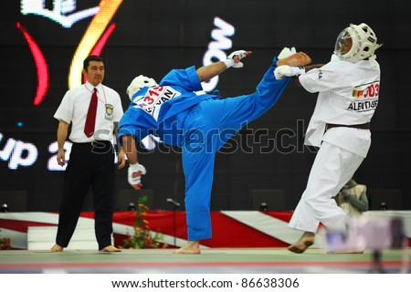 MOSCOW - FEB19: Fighter holding leg of another fighter at World Cup 2011 KUDO in Olympiysky Sports Complex, on Feb 19, 2011, Moscow, Russia. Fighters is Alentuge from Sri Lanka and Kolyan from Russia.