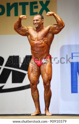 MOSCOW - APRIL 16: Dmitry Golubochkin competes at the Open Cup of bodybuilding and fitness of Moscow in hall at hotel Cosmos on April 16, 2011 in Moscow, Russia.
