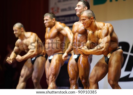 MOSCOW - APRIL 16: Alexey Thronov, Dmitry Karakash, Sergey Rodin, Sergei Doronichev are winners of Open Cup of bodybuilding of Moscow in hall at hotel Cosmos, on April 16, 2011 in Moscow, Russia.