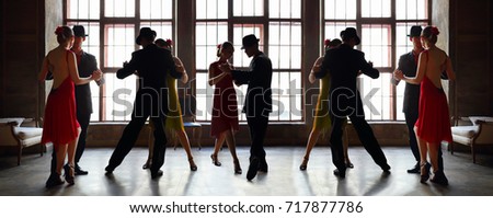 woman in red dress and man in black suit dance tango near window, collage with two model