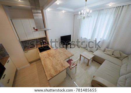 Interior of modern kitchen and lounge room.