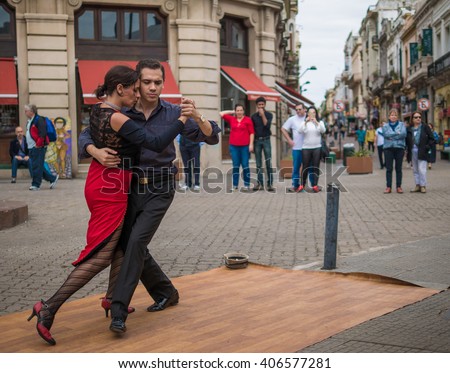 MONTEVIDEO - APRIL 9: A pair of tango dancers perform on April 9, 2016 in the old town of Montevideo, Uruguay. The tango dance originated from Montevideo and Buenos Aires, Argentina.