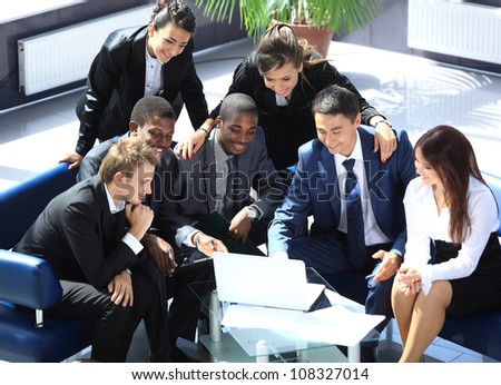 Happy working business team in modern office