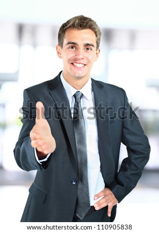 happy smiling businessman giving hand for handshake