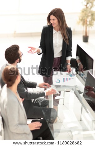 business woman discusses with the business team financial performance