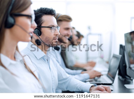 close up.background image of call center employees in the workplace