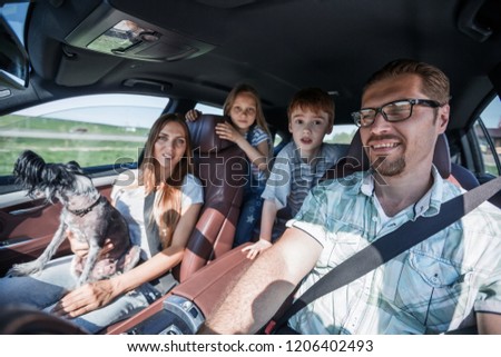 friendly family travels in a comfortable car