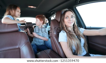 young mother driving a car