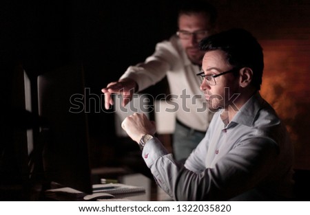 businessman working with documents dark office