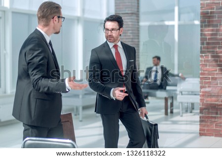 Manager meets the client at the Bank office.