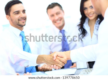 Business people shaking hands at a meeting