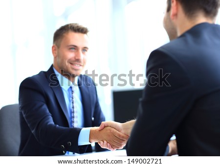 Businessman Shaking Hands To Seal A Deal With His Partner