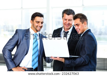 group of business people doing presetation with laptop during meeting
