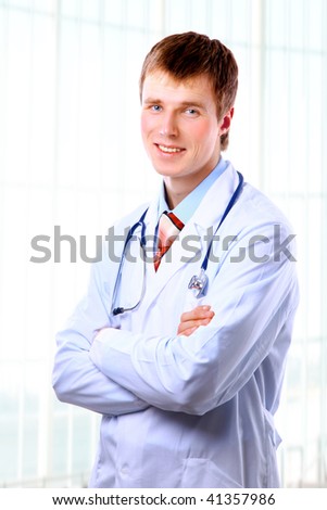 Smiling medical doctor with stethoscope. Isolated over white background