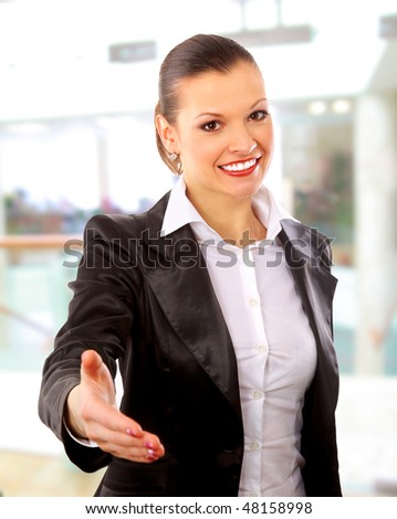 Portrait of a woman with an open hand ready to seal a deal