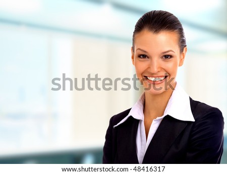 Positive business woman smiling over white background