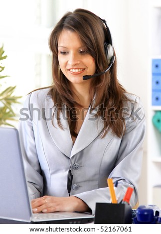 Happy woman calling on phone at home office