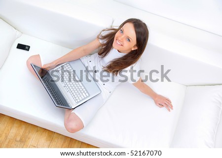Top view of happy mature lady working on laptop
