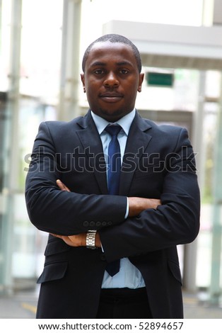 Portrait of an African American business man looking upwards