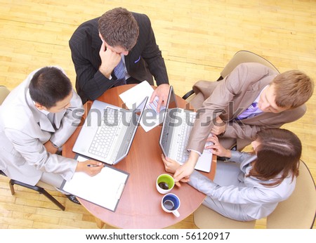 Top view of business people sitting in the meeting